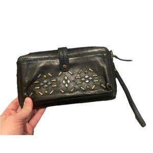 The Sak Black Leather Wristlet with Gold Details
